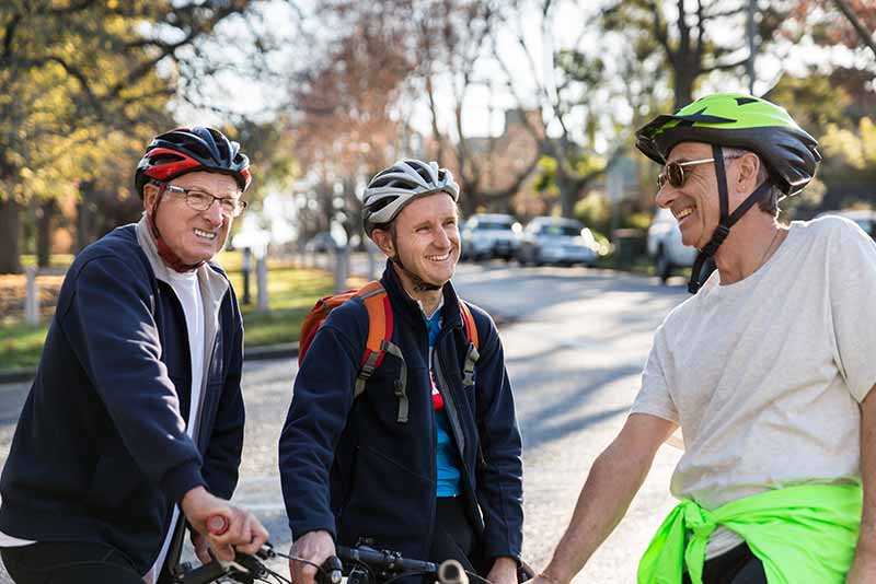 Father and son biking in the city